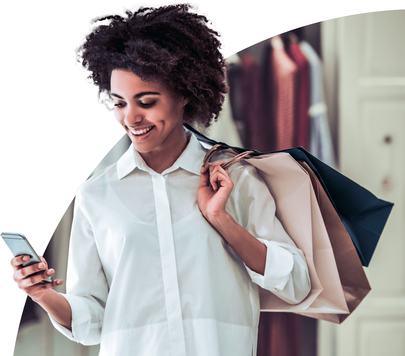 Woman looking at phone while shopping